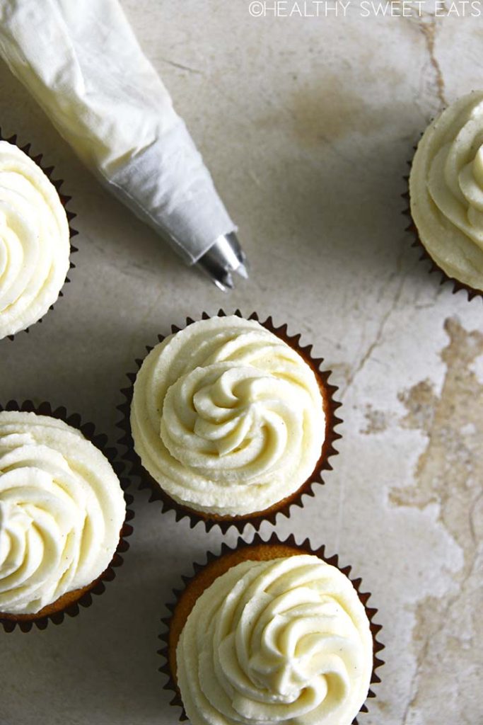 overhead view of vanilla cupcakes with vanilla keto buttercream frosting